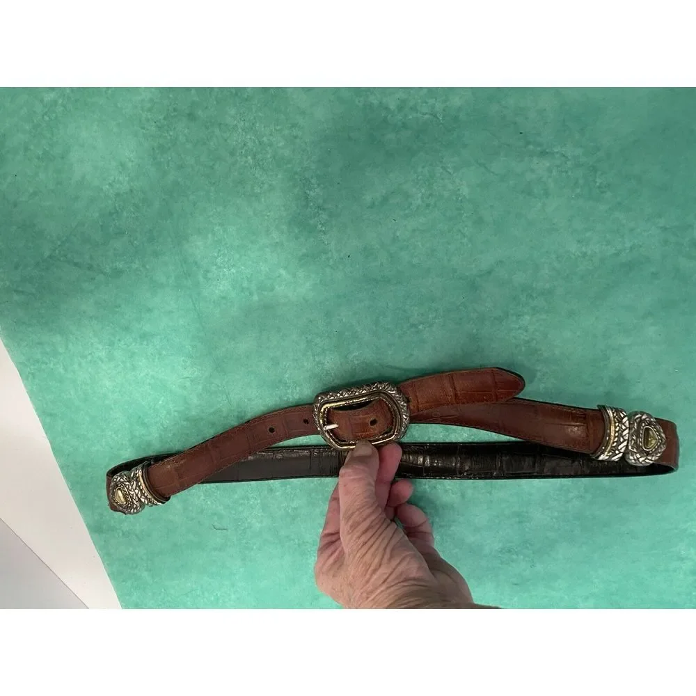 Ladies leather reversible belt black and brown with embellishments. Size med/30.